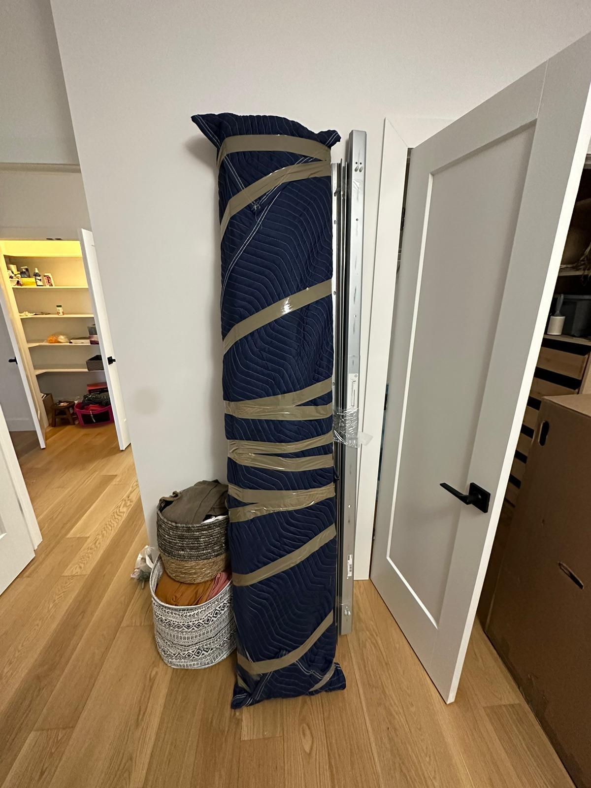 Tall item wrapped and protected for a move in Montreal